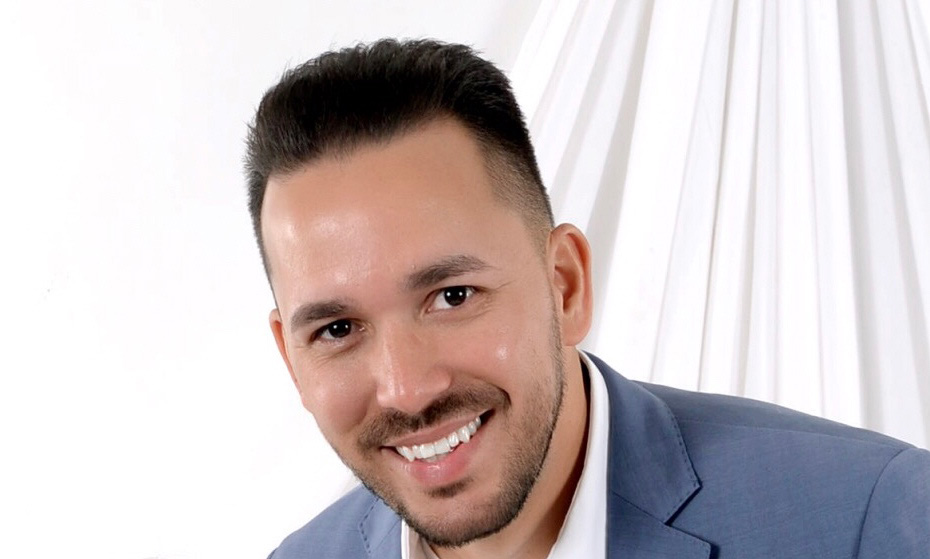 Smiling man in suit and white background